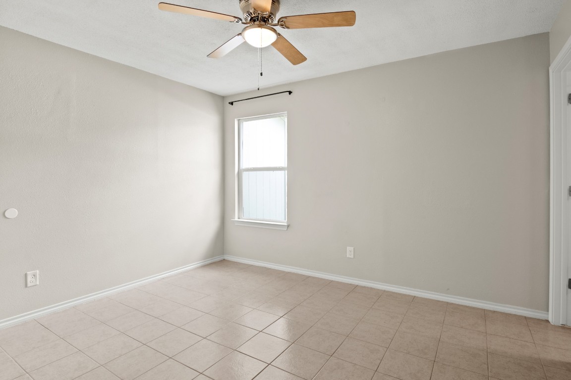 23393 Nameless Road, Unit 160 Leander, TX 78641 - Photo 11 of 20 an empty room with windows and fan