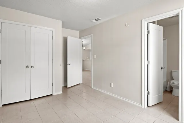 a view of a bathroom with a shower and a toilet