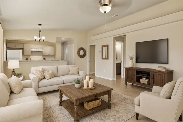 a living room with furniture and a flat screen tv