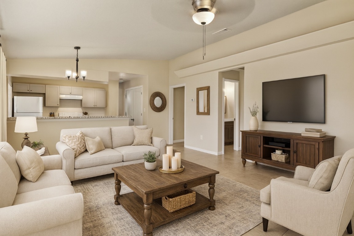 23393 Nameless Road, Unit 160 Leander, TX 78641 - Photo 3 of 20 a living room with furniture and a flat screen tv