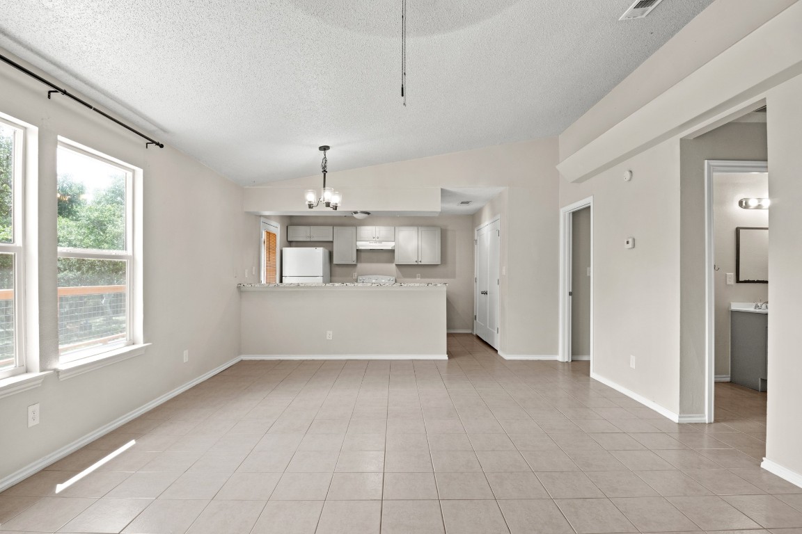 23393 Nameless Road, Unit 160 Leander, TX 78641 - Photo 7 of 20 a view of an empty room with a window
