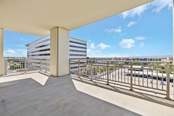 a view of a balcony with city view