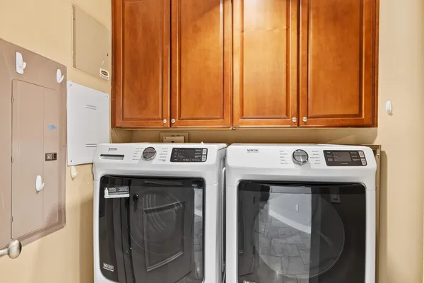 a utility room with dryer and washer
