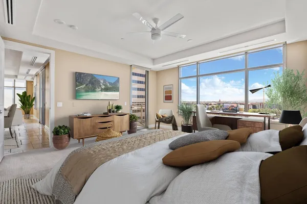 a bedroom with a large bed and a large window