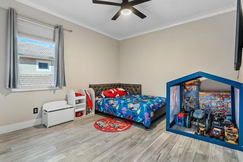 a bedroom with furniture and a wooden floor