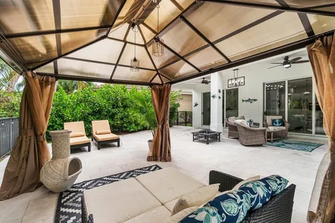 a outdoor space with couch and chairs