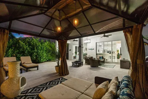 a view of living room with furniture and floor to ceiling window