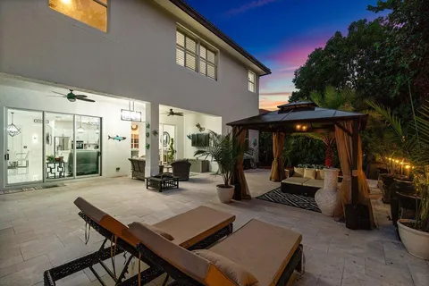 a dining room with a table and chairs