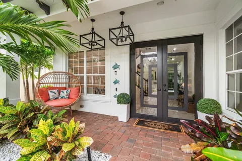 a view of a two chairs in the patio