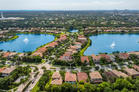 an aerial view of residential houses with outdoor space and river