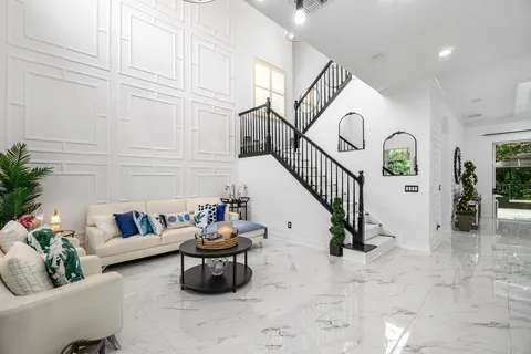 a living room with furniture and white walls