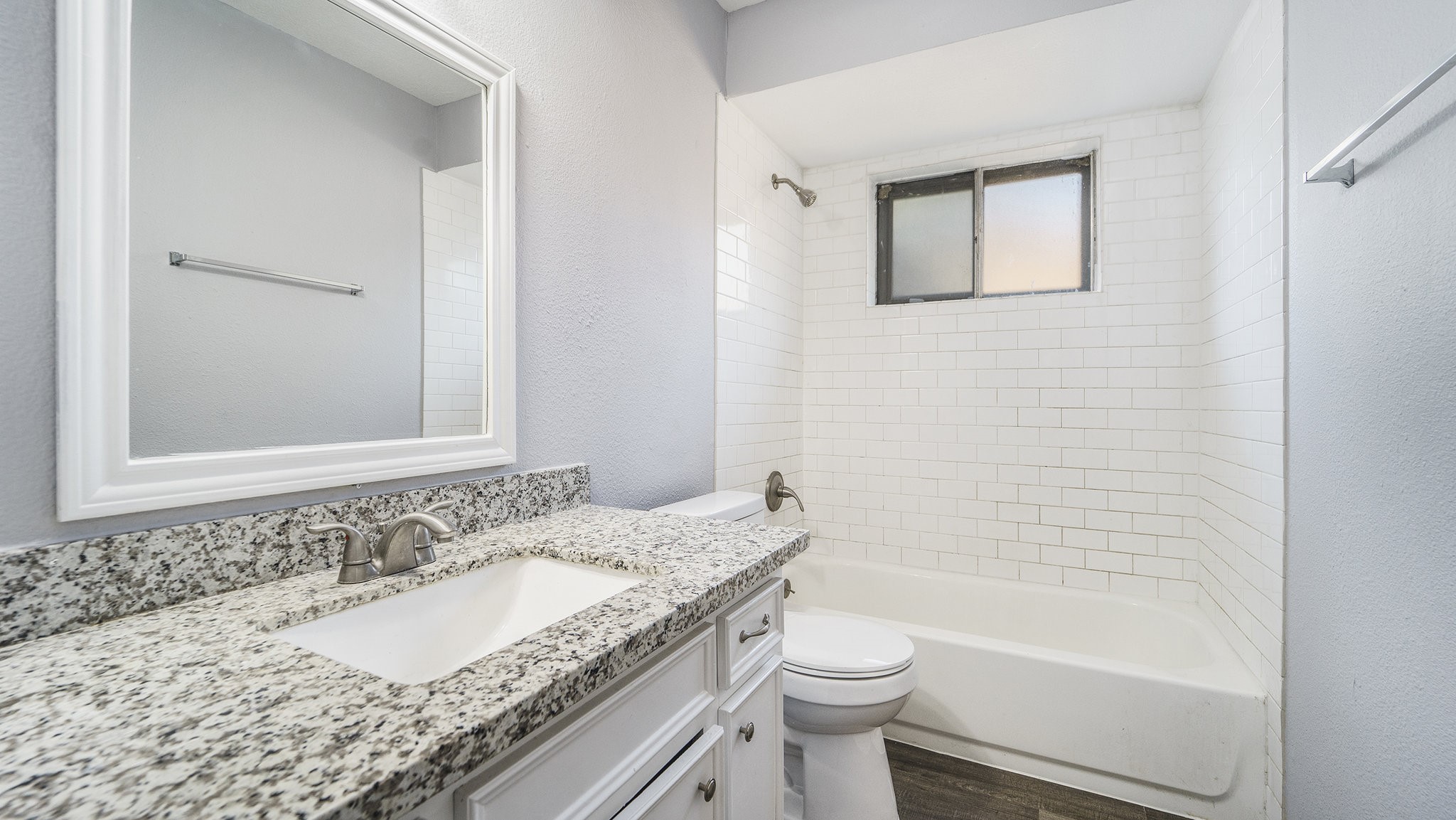 3008 Columbia Street Baytown, TX 77521 - Photo 18 of 23 a bathroom with a granite countertop sink a toilet and shower