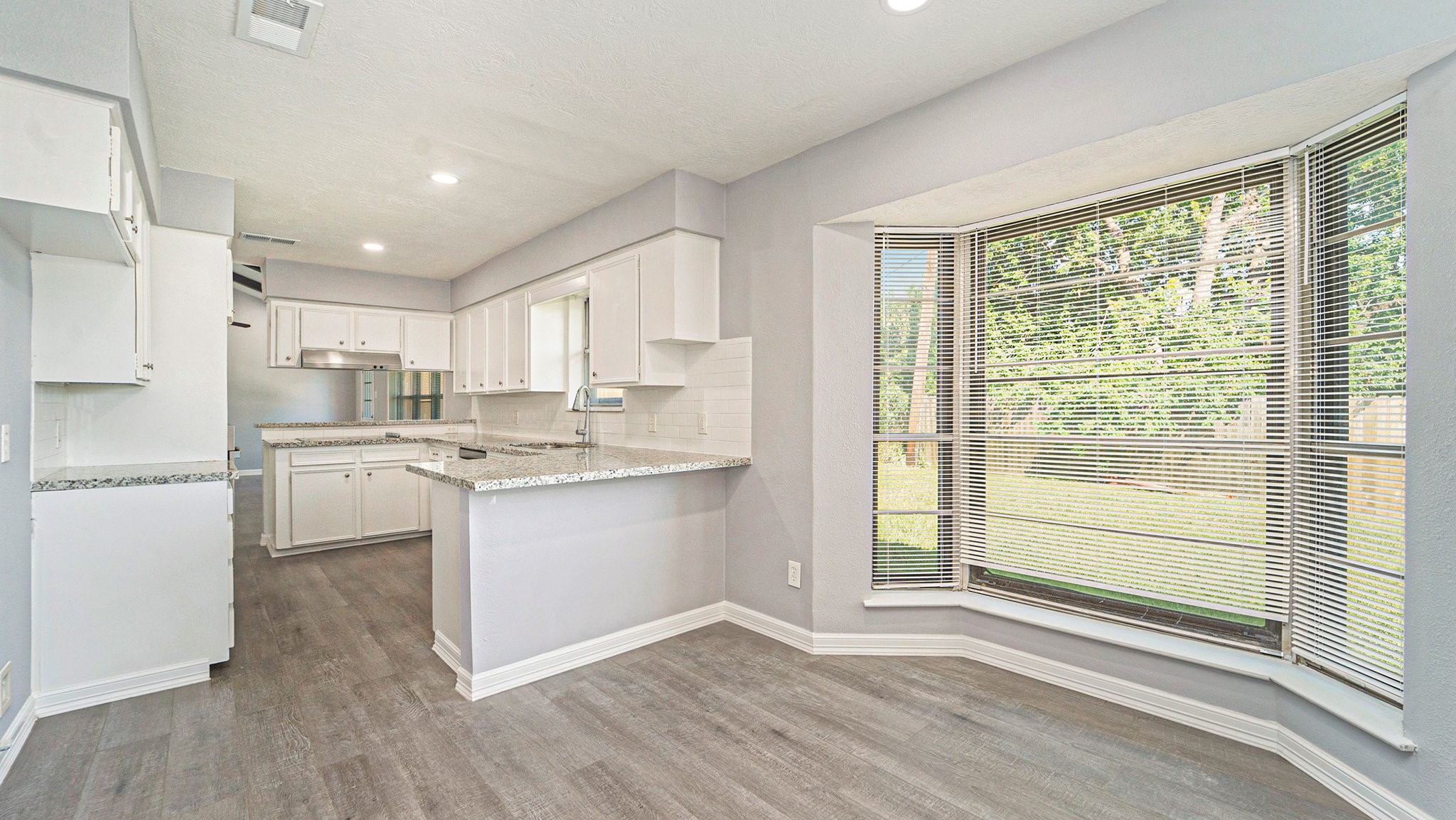 3008 Columbia Street Baytown, TX 77521 - Photo 8 of 23 a kitchen with white cabinets and white appliances