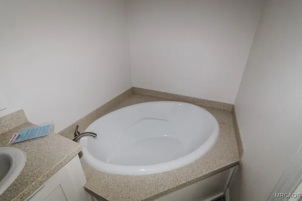 a bath tub sitting in a bathroom
