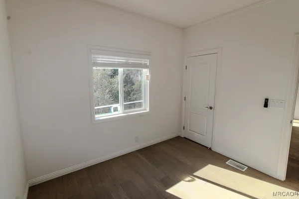 a view of an empty room and window