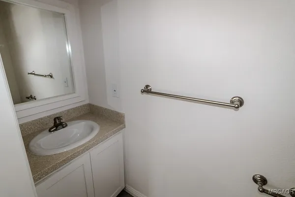 a bathroom with a sink and mirror