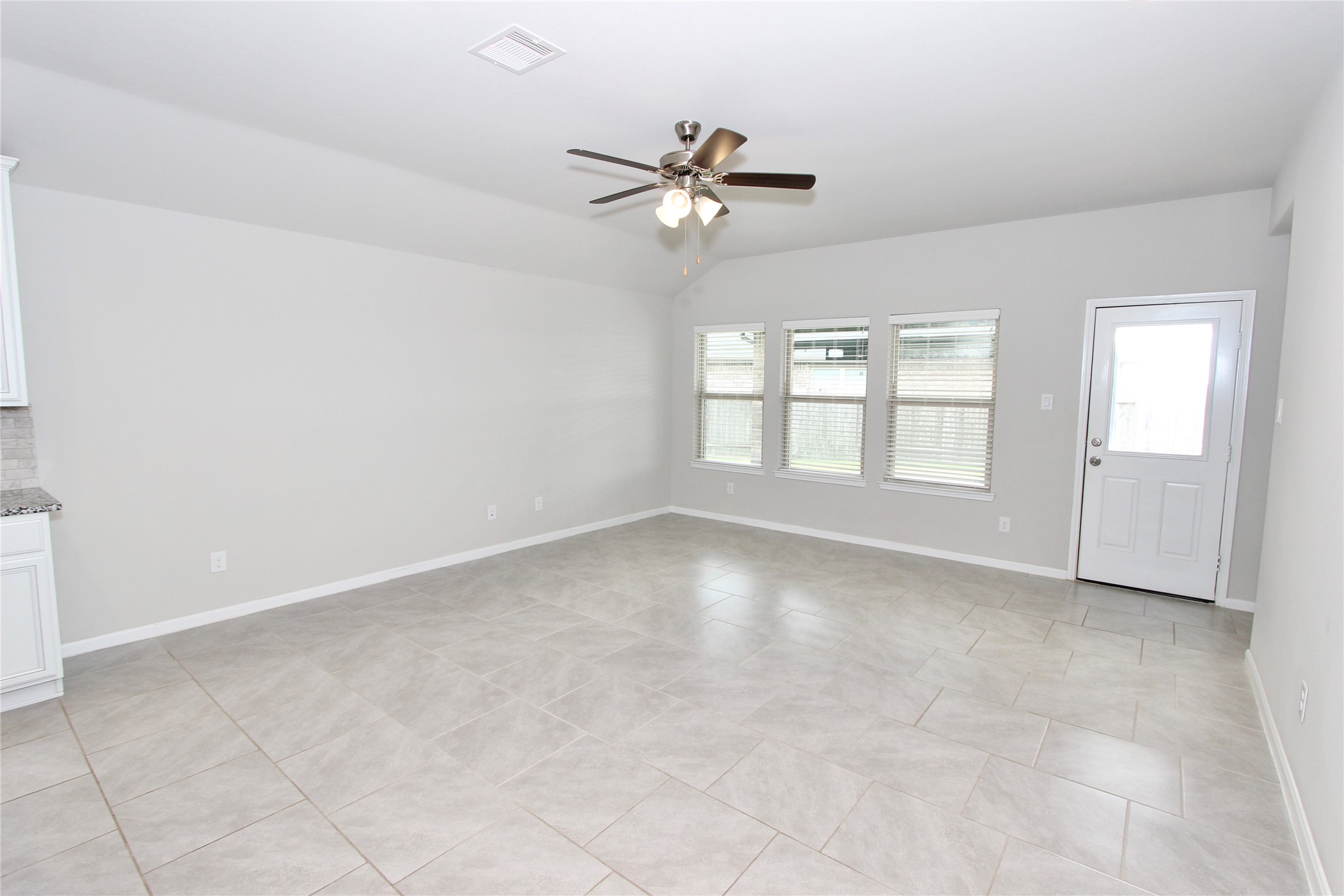 1303 Keaton Court Rosenberg, TX 77469 - Photo 6 of 22 a view of an empty room with a window