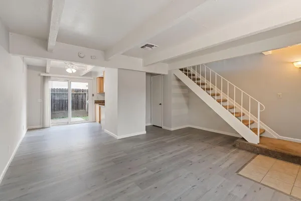 a view of an entryway with wooden floor