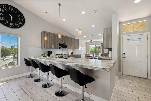 a kitchen with counter space cabinets and appliances