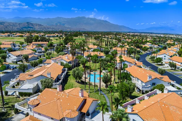 an aerial view of residential houses and outdoor space