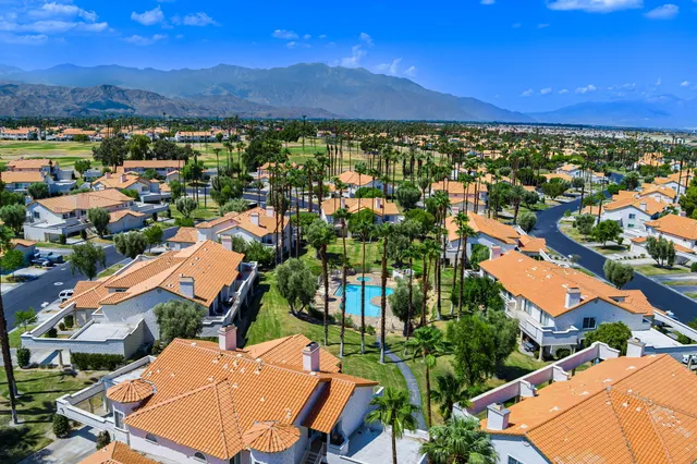 an aerial view of residential houses and outdoor space