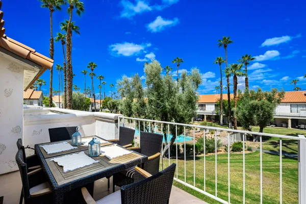 a view of a house with backyard sitting area