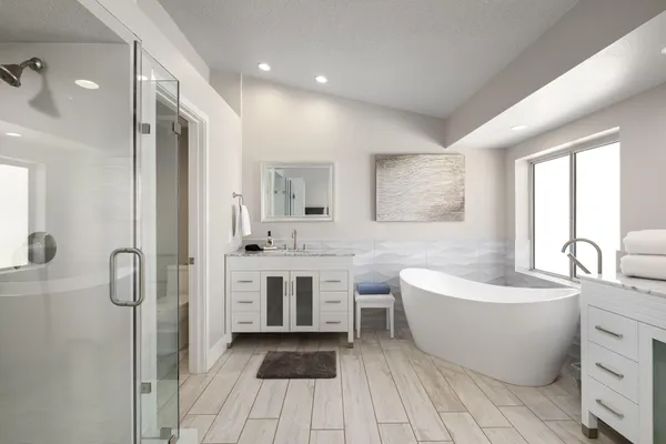 a bathroom with a bathtub sink and window