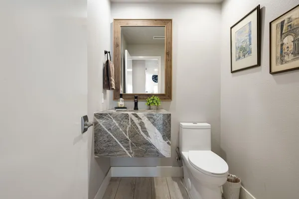 a bedroom with two beds and a chandelier