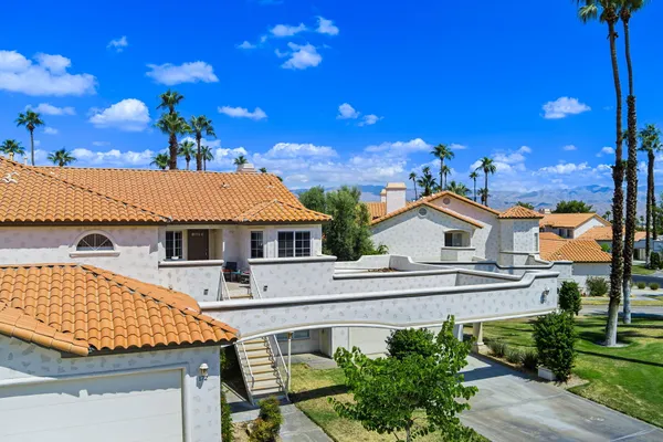 an aerial view of residential house with outdoor space and trees