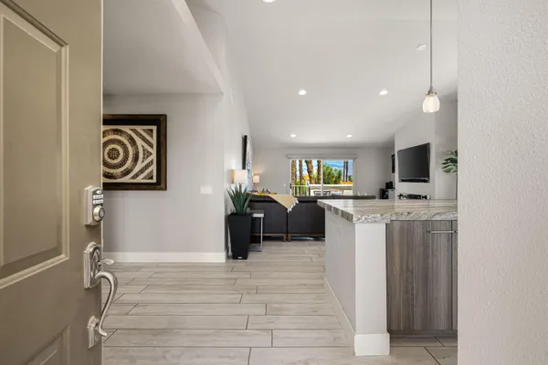 a view of a kitchen with furniture and a window