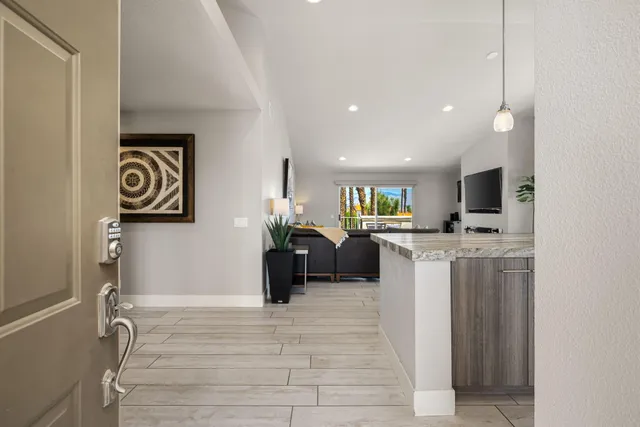 a view of a kitchen with furniture and a window