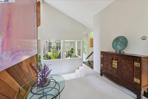 a balcony with a table and chairs