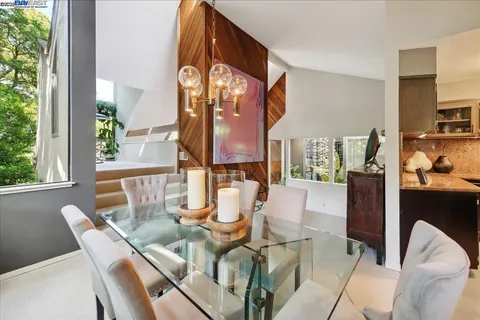 a kitchen with stainless steel appliances granite countertop a stove and a refrigerator