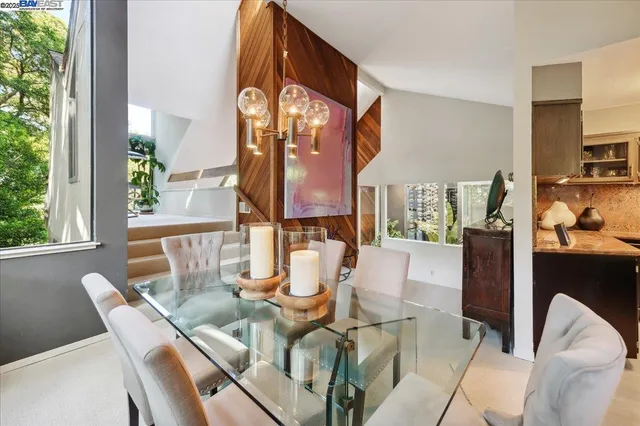 a kitchen with stainless steel appliances granite countertop a stove and a refrigerator