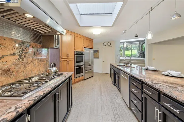 a kitchen with a table and chairs in it