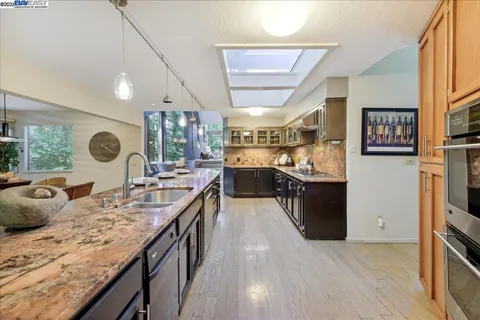 a living room with furniture and a clock