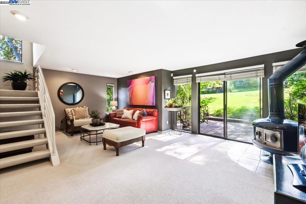 391 Oak Lane Pleasanton, CA 94566 - Photo 29 of 60 a living room with furniture and a floor to ceiling window