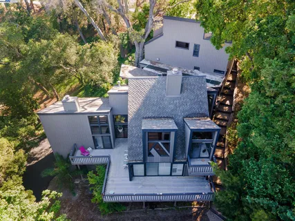 a view of sign board with flower plants