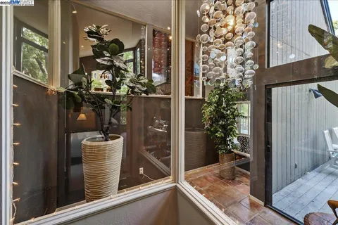 a view of a two chairs in the balcony