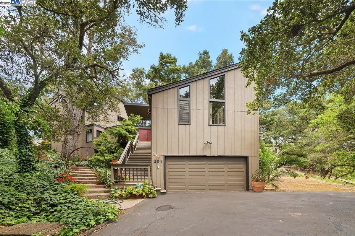 391 Oak Lane Pleasanton, CA 94566 - Photo 4 of 60 a front view of a house with a yard