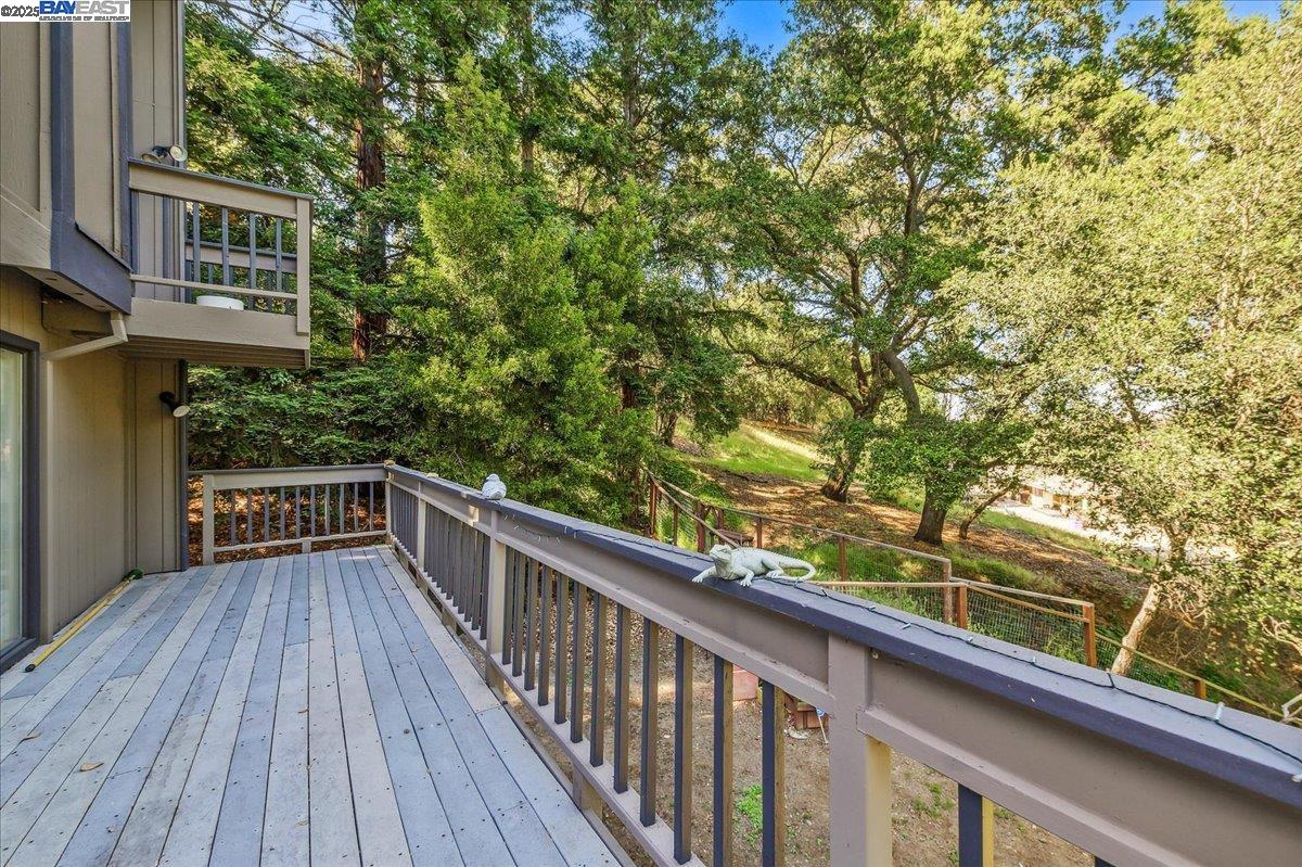 391 Oak Lane Pleasanton, CA 94566 - Photo 44 of 60 a view of balcony with wooden floor and fence