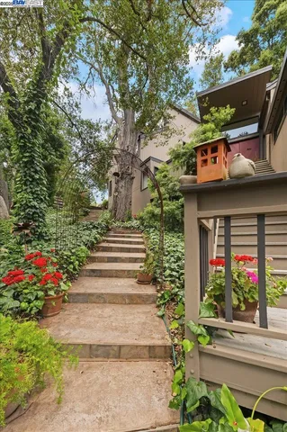 a living room with furniture fireplace and a large window