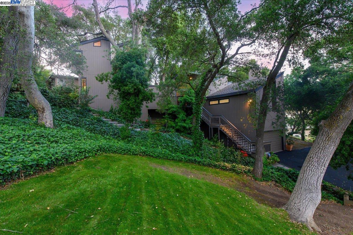 391 Oak Lane Pleasanton, CA 94566 - Photo 6 of 60 a view of a house with a backyard