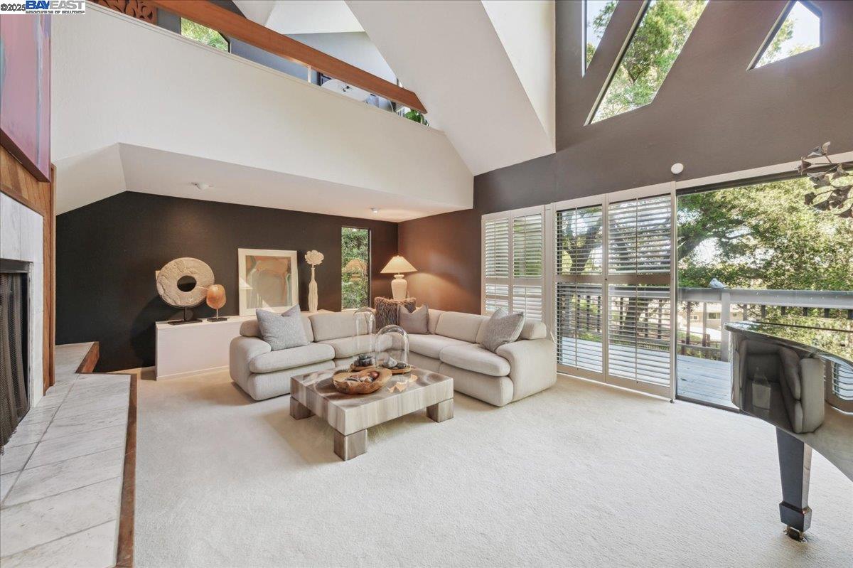 391 Oak Lane Pleasanton, CA 94566 - Photo 9 of 60 a living room with furniture fireplace and a large window