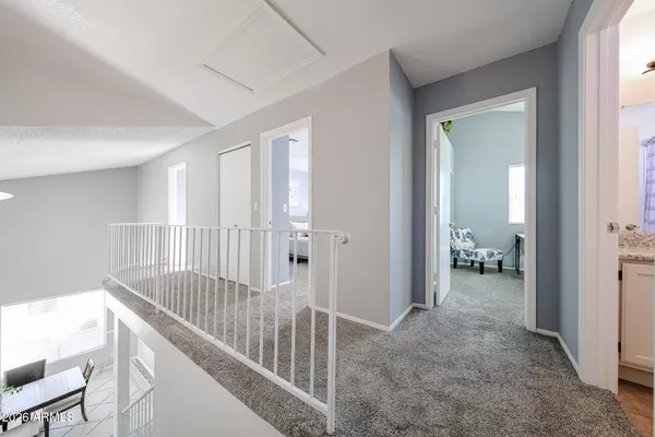 a view of a hallway and interior of house