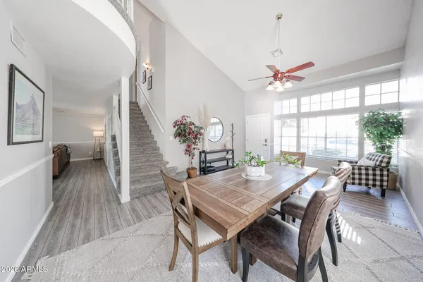 a view of a dining room with furniture window and wooden floor