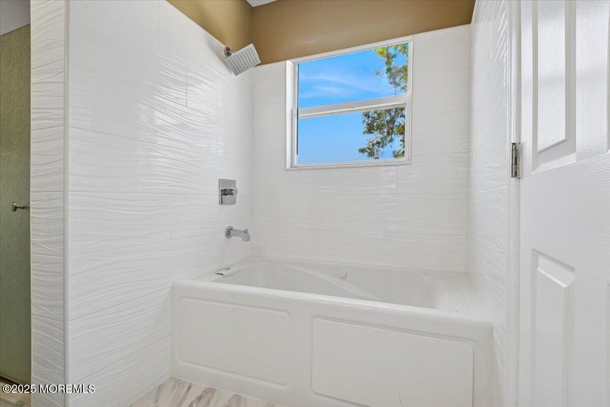 2 Higgins Court Howell, NJ 07731 - Photo 29 of 49 a bathroom with a bathtub