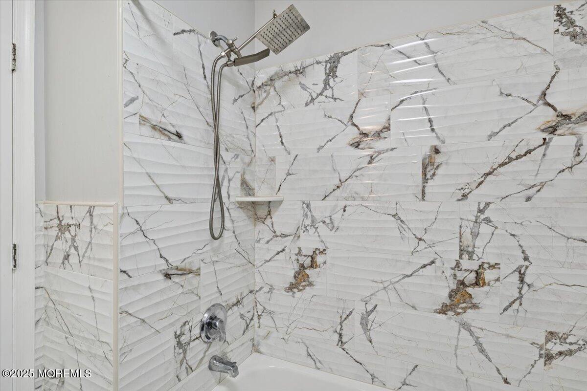 2 Higgins Court Howell, NJ 07731 - Photo 34 of 49 a dirty bathroom with white tiles