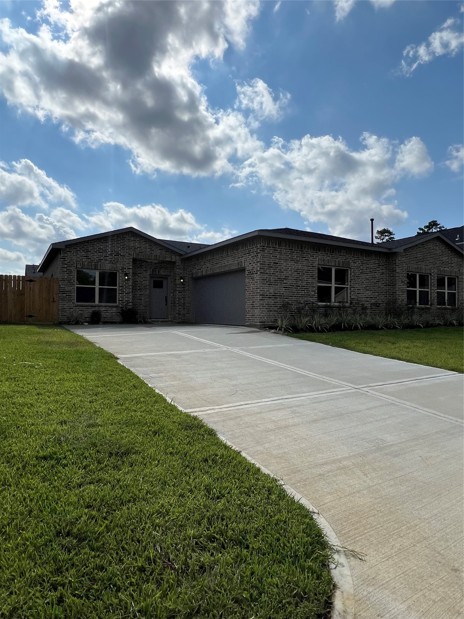 a view of house with yard and entertaining space