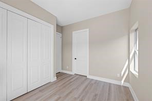2615 Piemonte Avenue Cir Spring Spring, TX 77388 - Photo 13 of 21 an empty room with wooden floor and windows